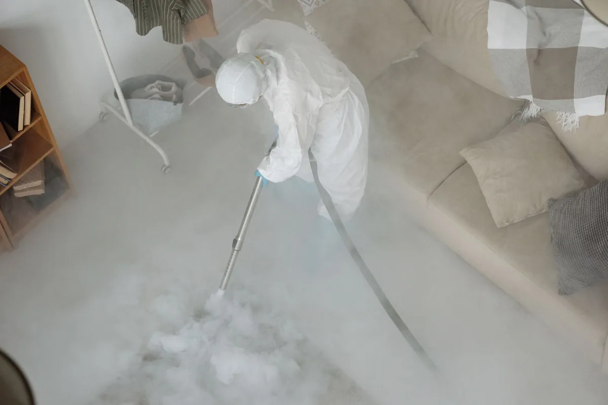 Biohazard cleanup technician in protective equipment, Madison, MN